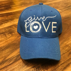 Blue cap with "give love" embroidered on the front in white