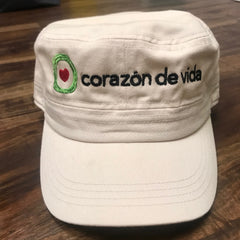 Cream cadet hat with Corazon de vida and logo embroidered on front in black