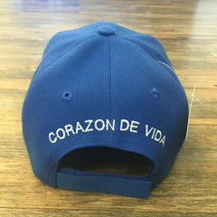 Blue 6 panel cap with Corazon de Vida embroidered on the back